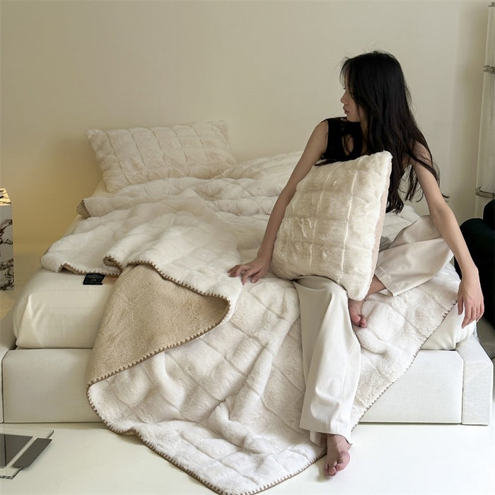 Scandinavian faux fur throw blanket with checkered pattern