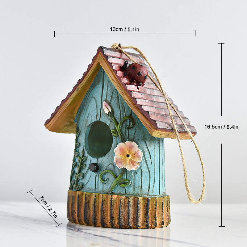 Decorative birdhouse made of resin for the wall