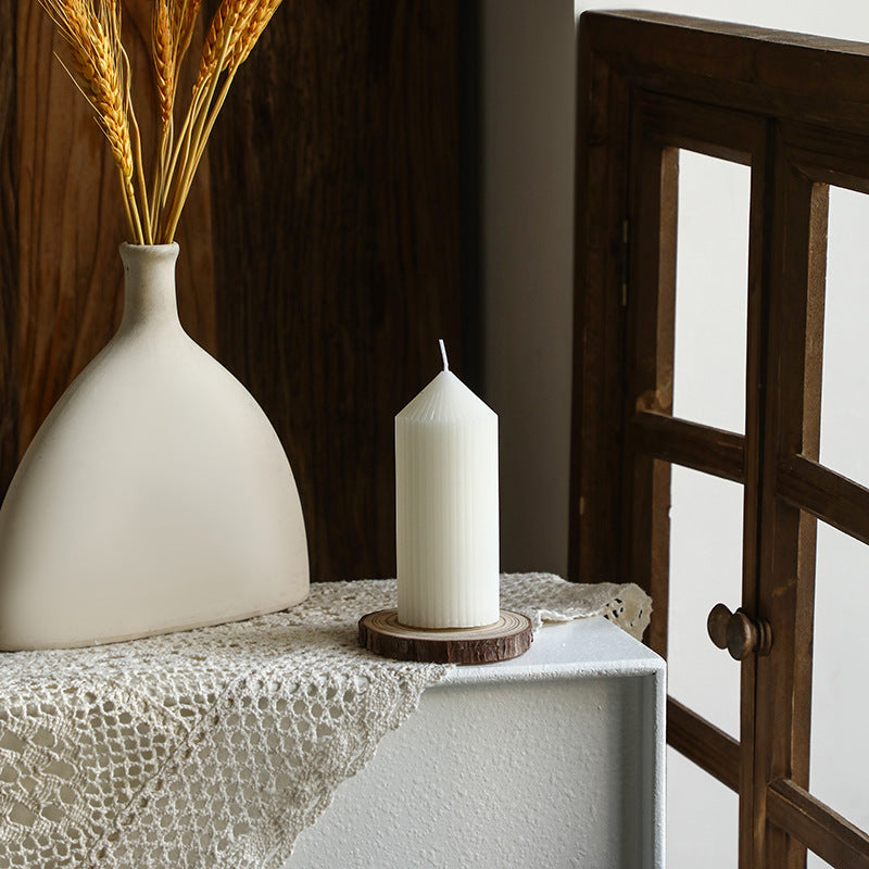 White tapered candle with striped pattern, Nordic