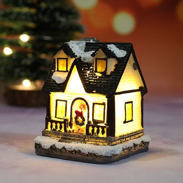 Illuminated Christmas house made of resin