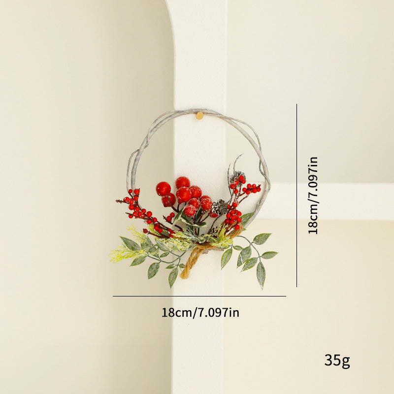 Christmas wreath with berries and pine needles