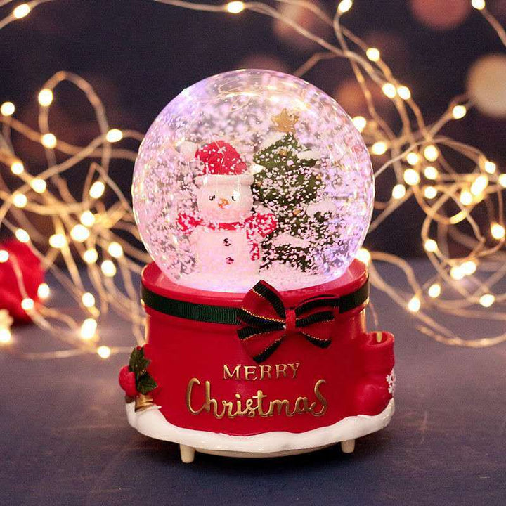 Illuminated snow globe music box with music