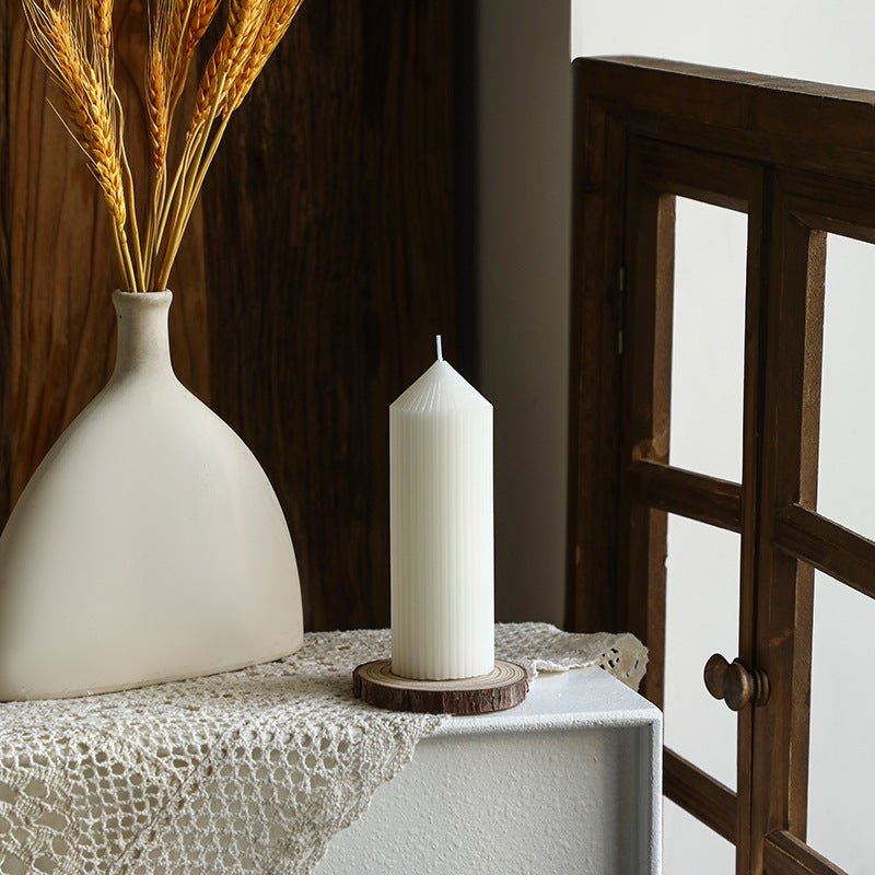 White tapered candle with striped pattern, Nordic