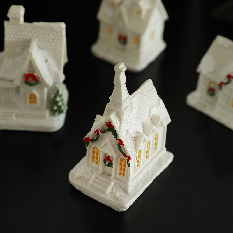 Illuminated miniature snow house made of resin