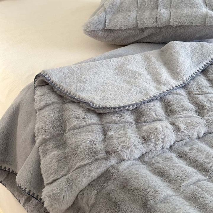Scandinavian faux fur throw blanket with checkered pattern
