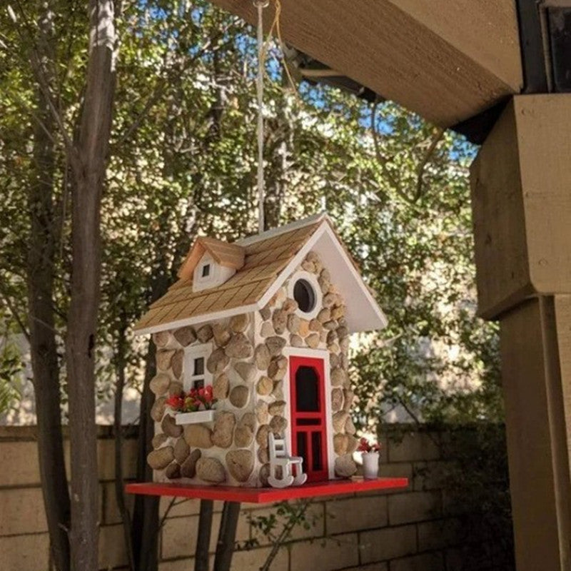 Decorative birdhouse in stone look made of resin