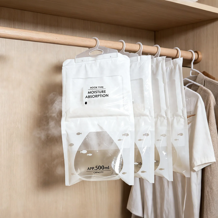 Hanging dehumidifying bag for wardrobes