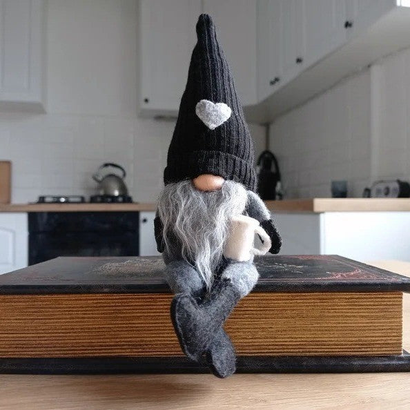 Decorative gnome with coffee cup
