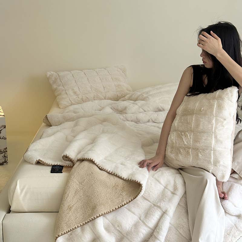 Scandinavian faux fur throw blanket with checkered pattern