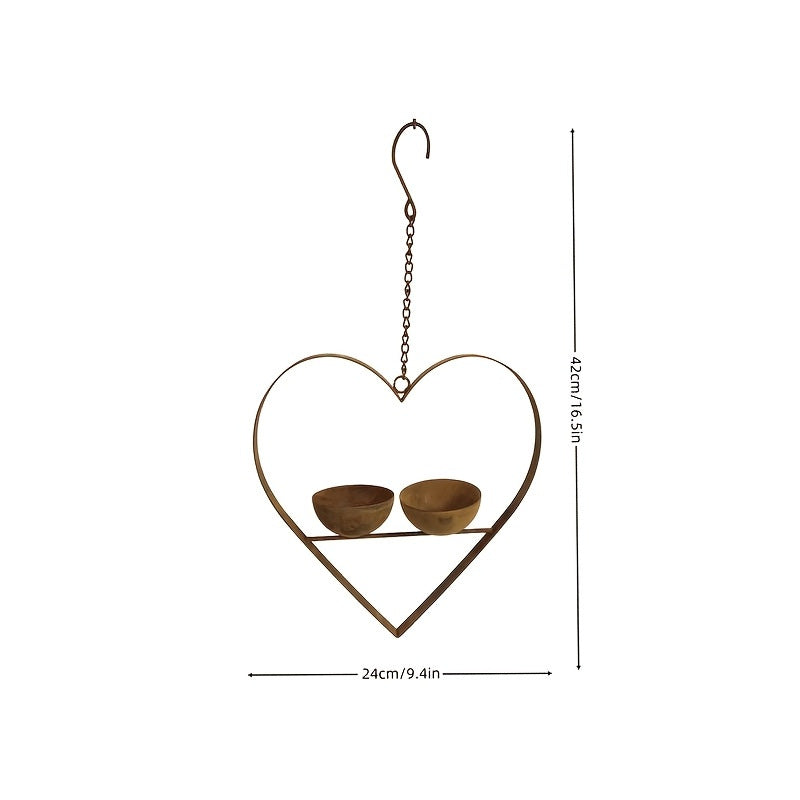 Heart-shaped bird feeder made of metal with two bowls