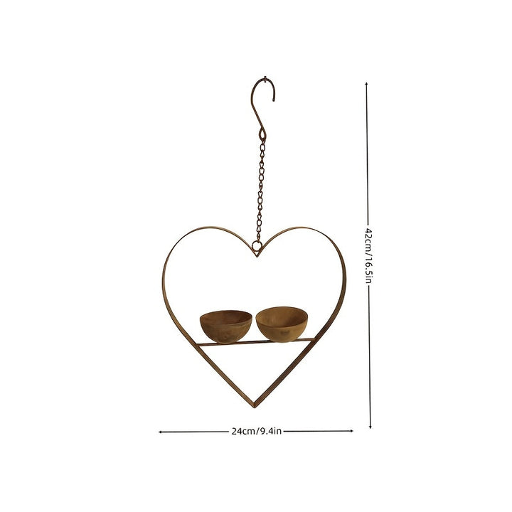 Heart-shaped bird feeder made of metal with two bowls