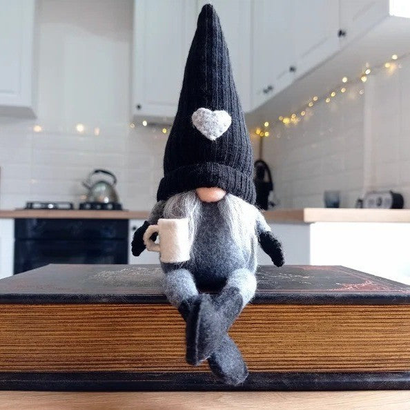 Decorative gnome with coffee cup