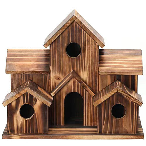 Decorative wooden birdhouse in country house style