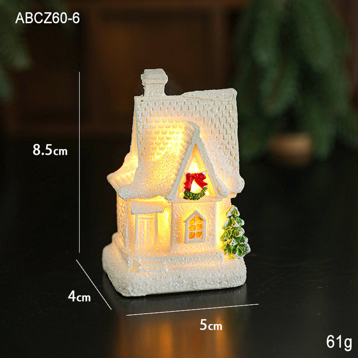 Illuminated miniature snow house made of resin