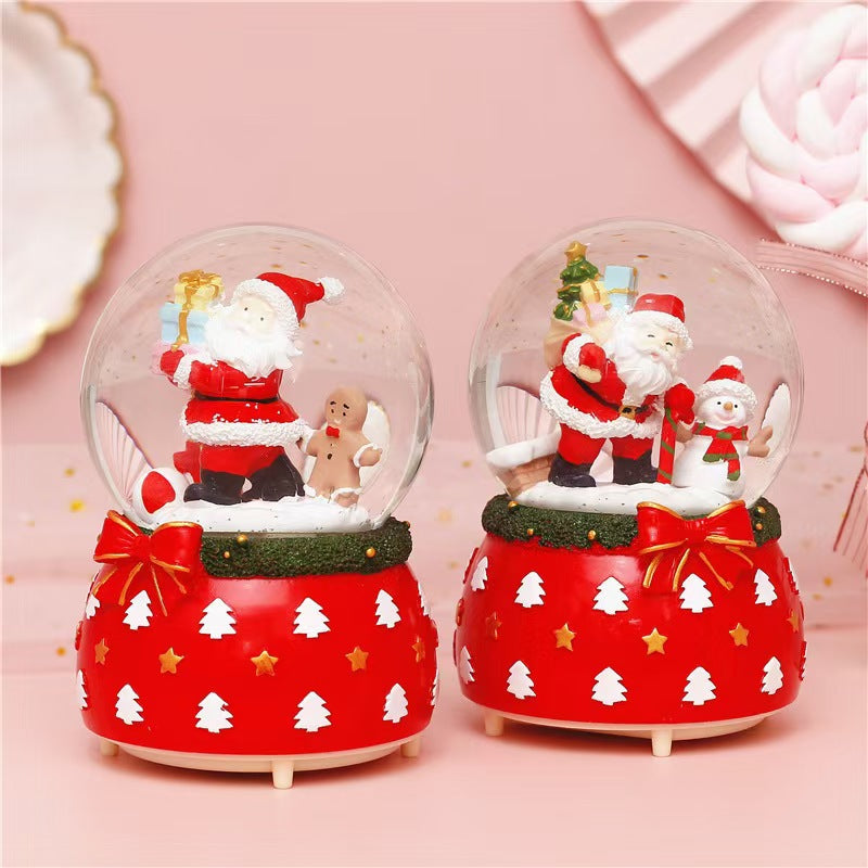Illuminated snow globe music box with music