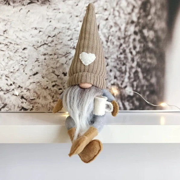 Decorative gnome with coffee cup