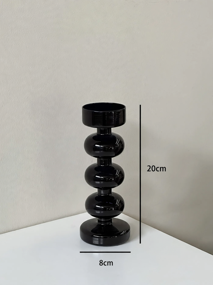 Decorative candle holder made of glass and wood
