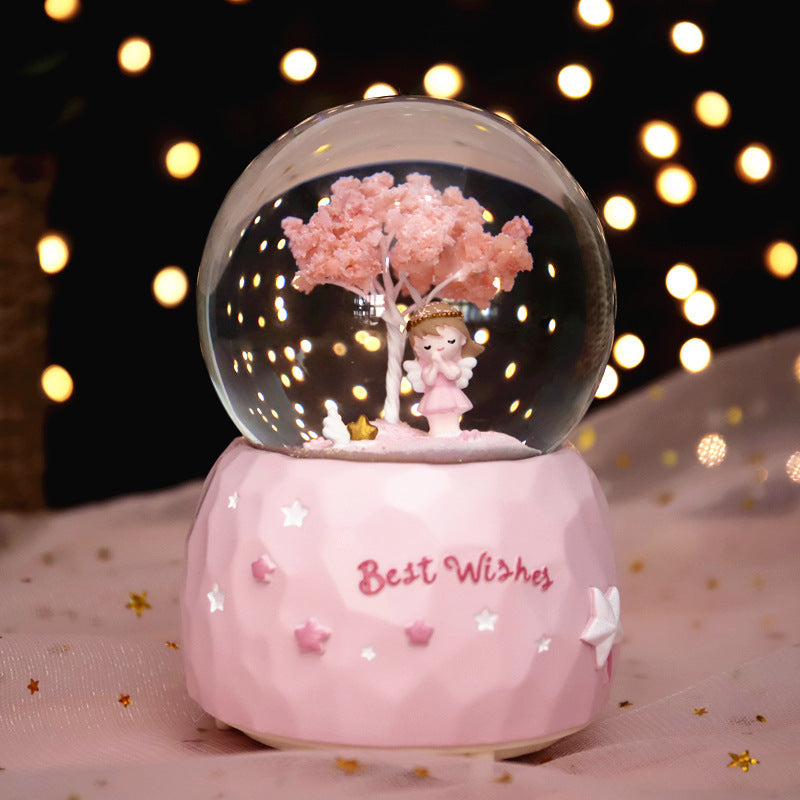 Fairy-tale snow globe with music and light