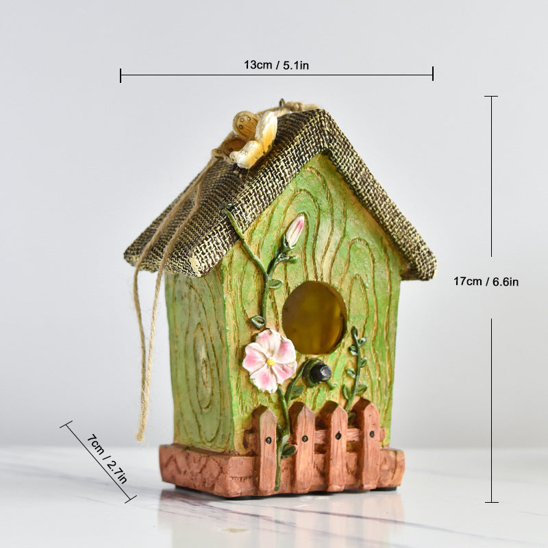 Decorative birdhouse made of resin for the wall