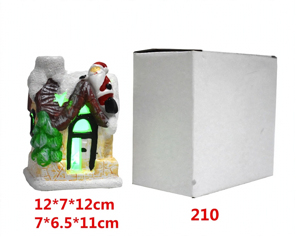 Illuminated Christmas house made of resin with snow effect