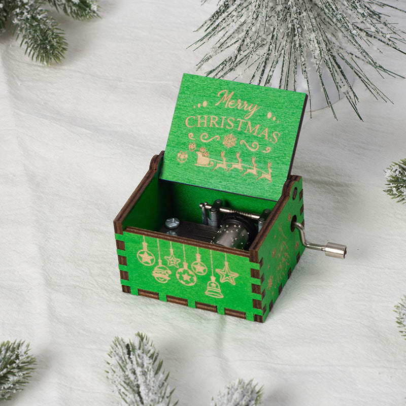 Manual wooden music box with crank