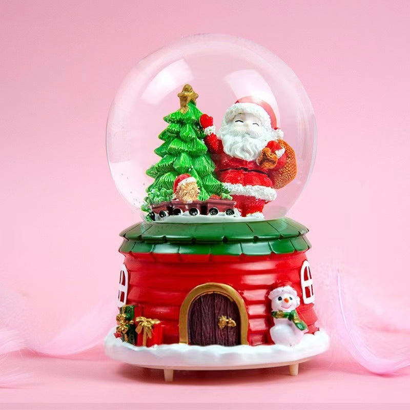 Illuminated snow globe music box with music