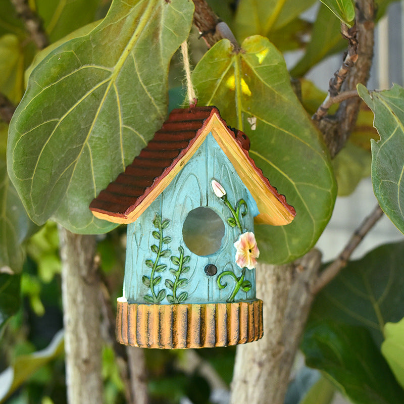 Decorative birdhouse made of resin for the wall