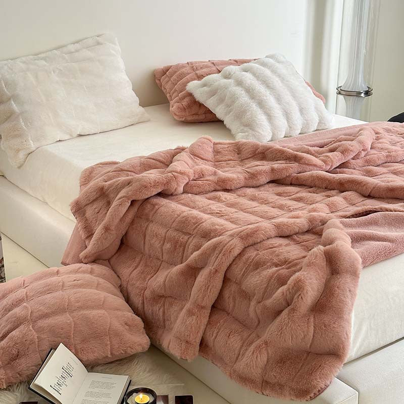 Scandinavian faux fur throw blanket with checkered pattern