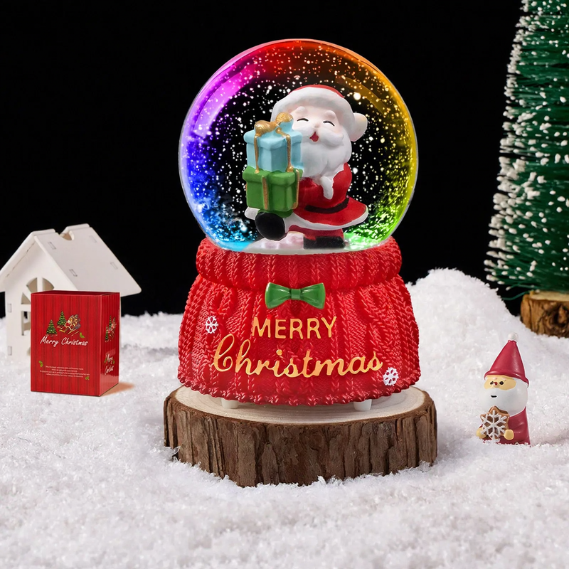 Christmas snow globe with music box and carriage design