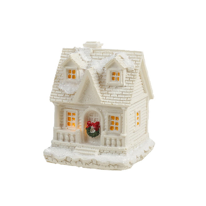 Illuminated miniature snow house made of resin