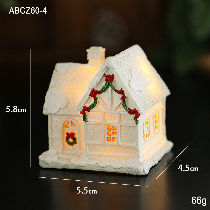 Illuminated miniature snow house made of resin