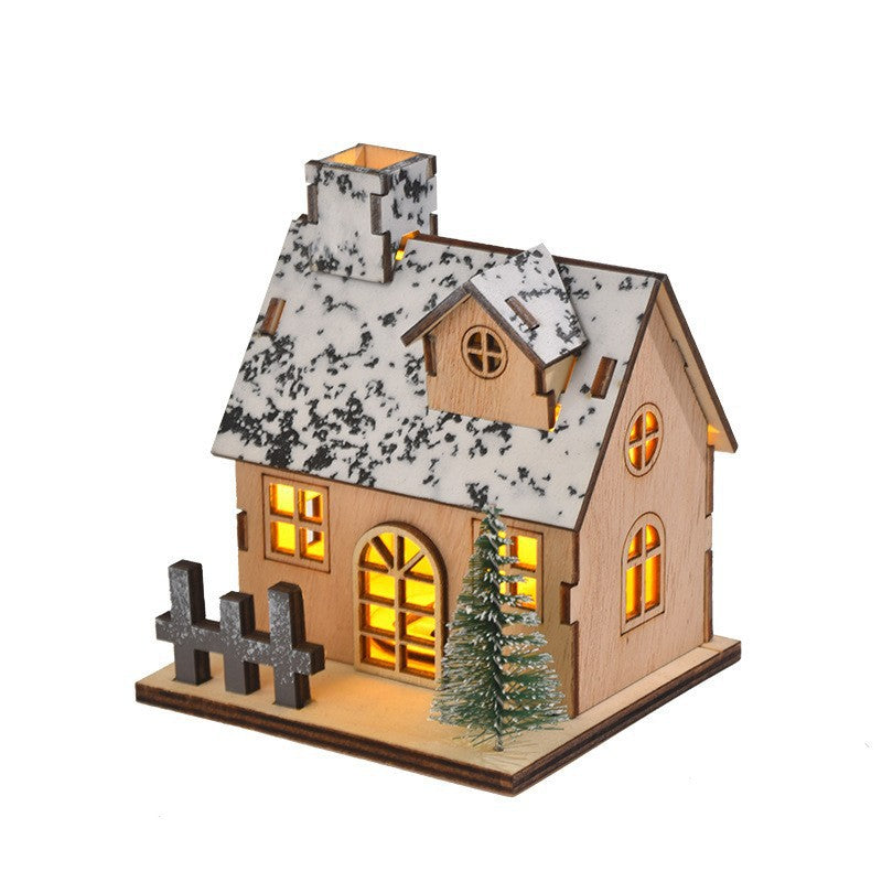 Illuminated wooden house for festive table decoration