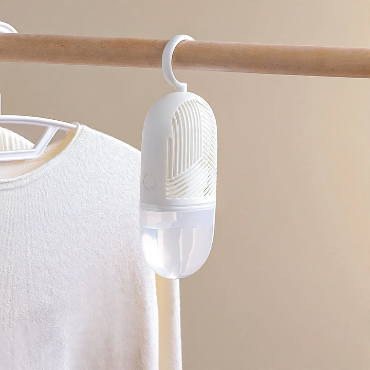 Hanging dehumidifier bag for wardrobes