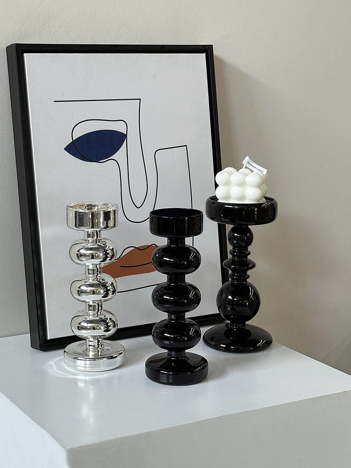 Decorative candle holder made of glass and wood