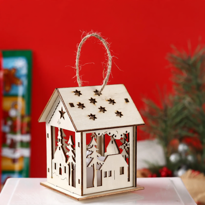 Illuminated wooden house as Christmas decoration