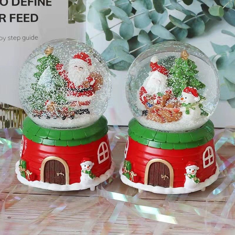 Illuminated snow globe music box with music
