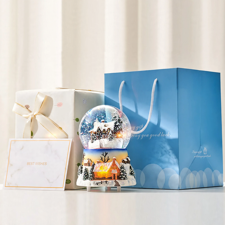 Musical snow globe music box with snow hut