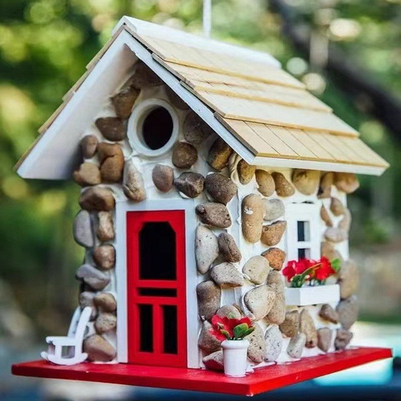 Decorative birdhouse in stone look made of resin