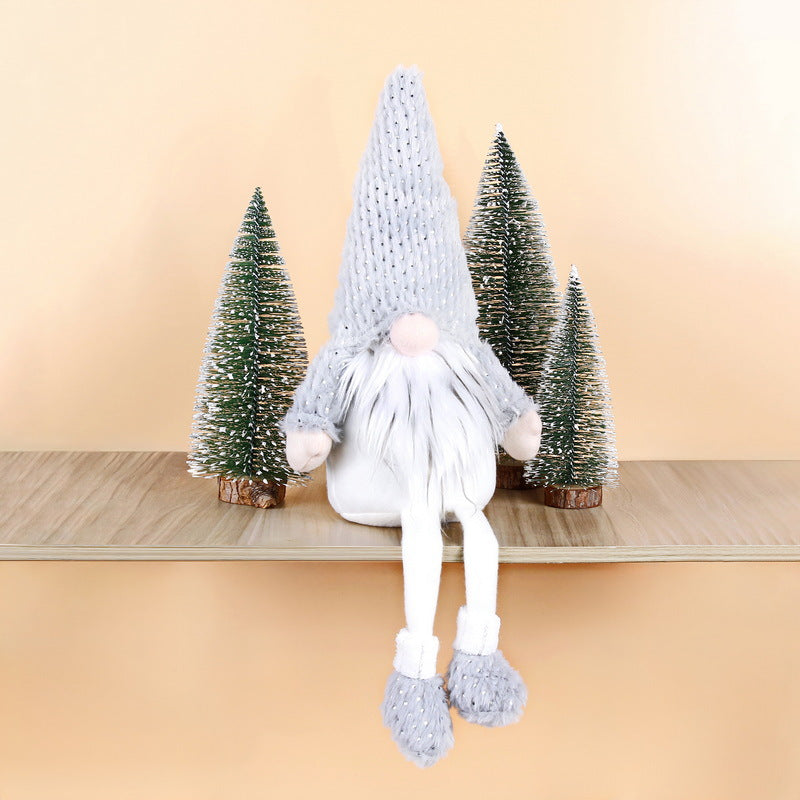 Christmas elf figure with long legs, sitting