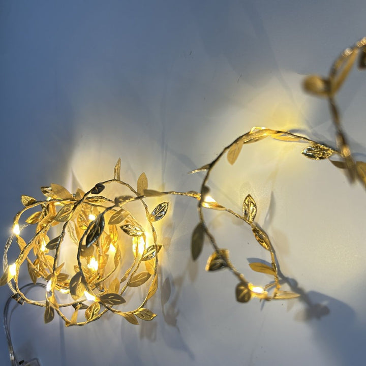 LED light chain with artificial leaves