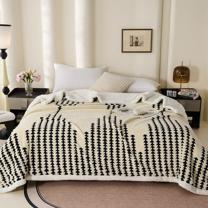 Double-layered throw blanket with lamb fleece look