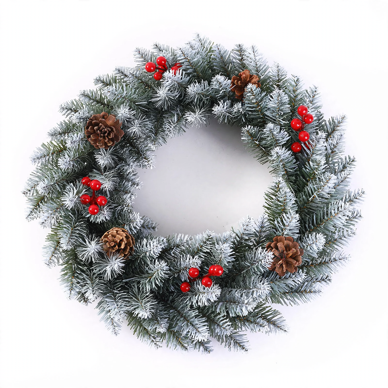Christmas wreath with berries and pine cones