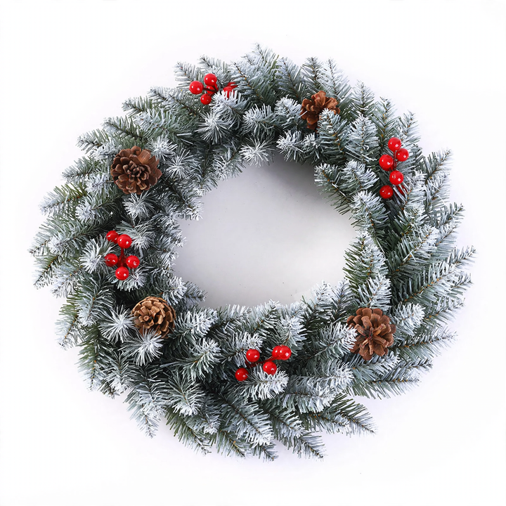 Christmas wreath with berries and pine cones