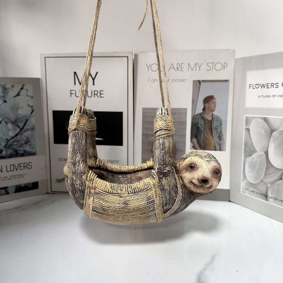 Decorative sloth feeder station for the garden