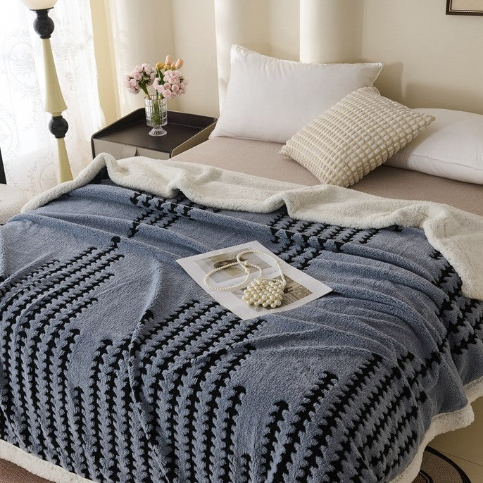 Double-layered throw blanket with lamb fleece look