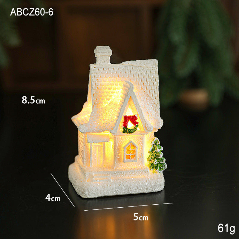 Illuminated miniature snow house made of resin
