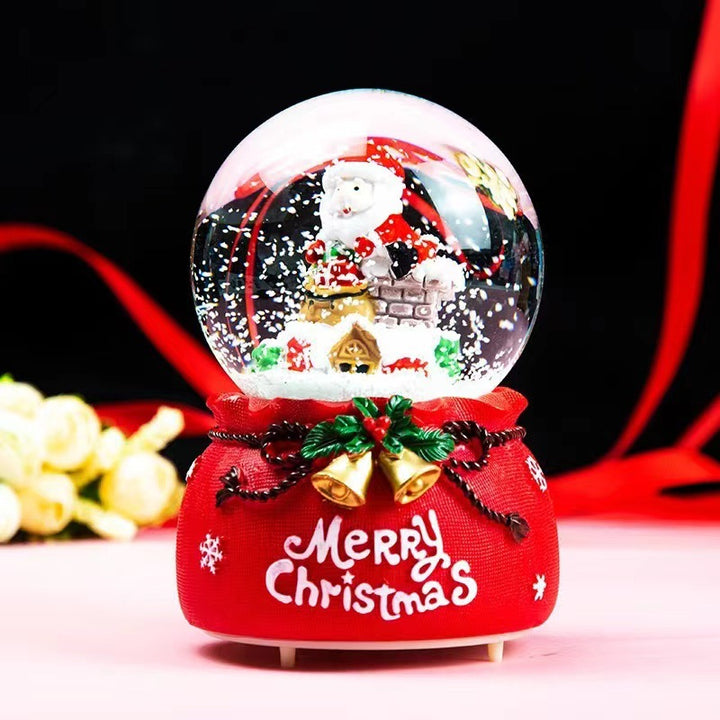 Illuminated snow globe music box with music