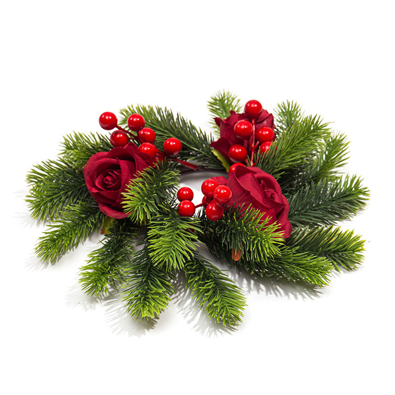 Christmas candle wreath with pine needles and berries