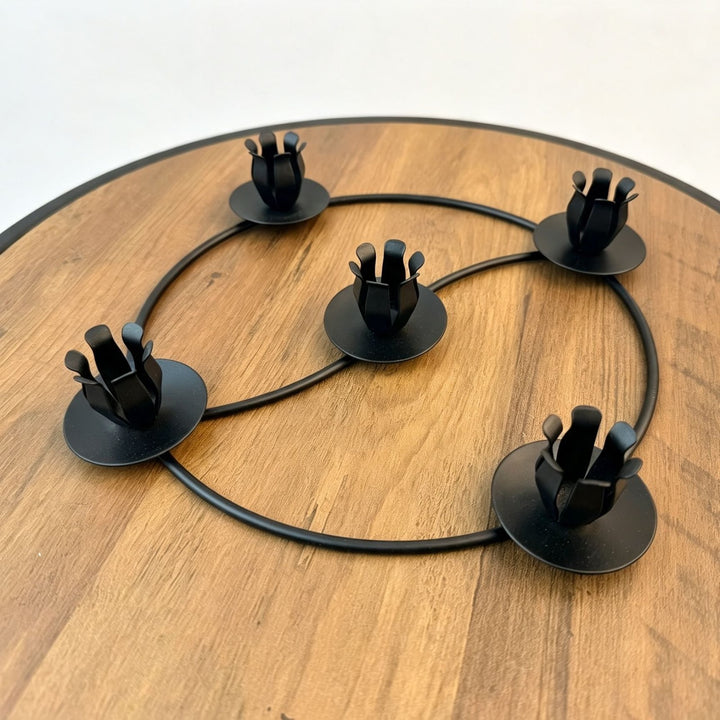 Metal candle holder in wreath design