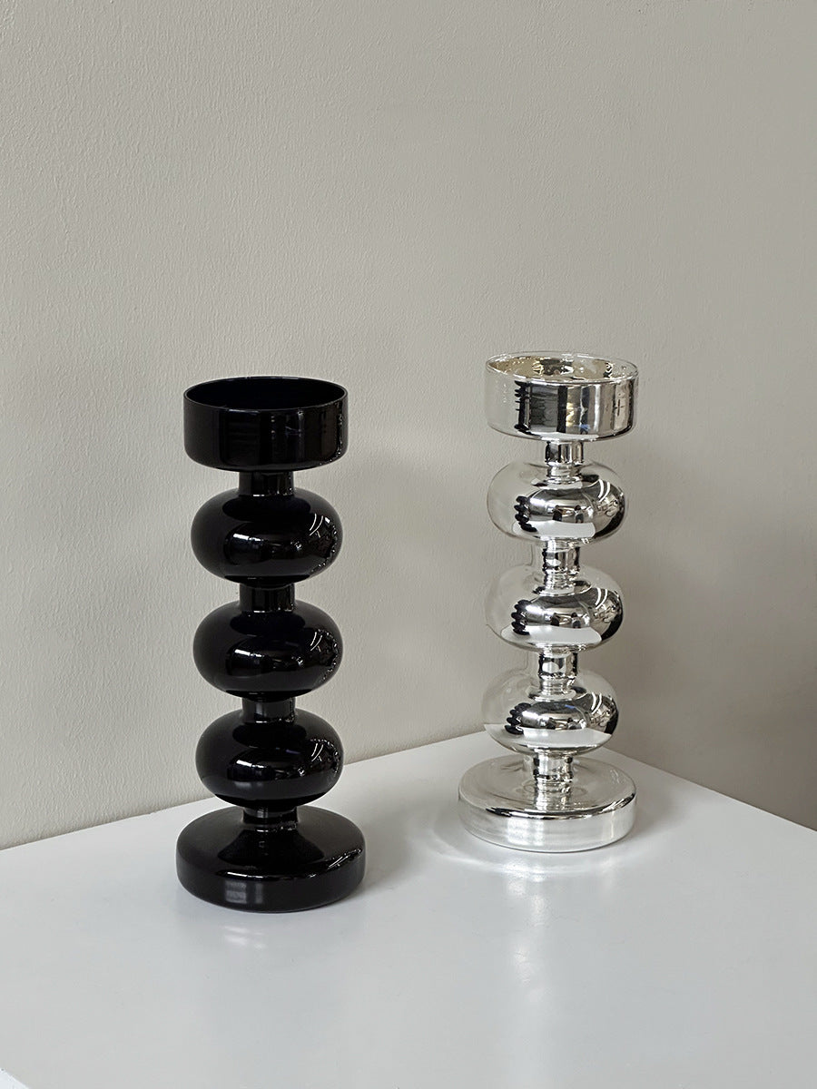 Decorative candle holder made of glass and wood